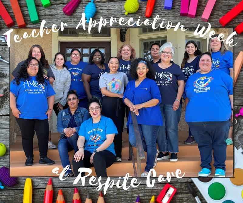 Group of women smiling, wearing blue Autism t-shirts